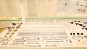 Complete component layout of LED tubular lights including transparent and frosted PC/PMMA tubes, aluminum profiles, end caps, mounting brackets, sealing parts, and LED drivers