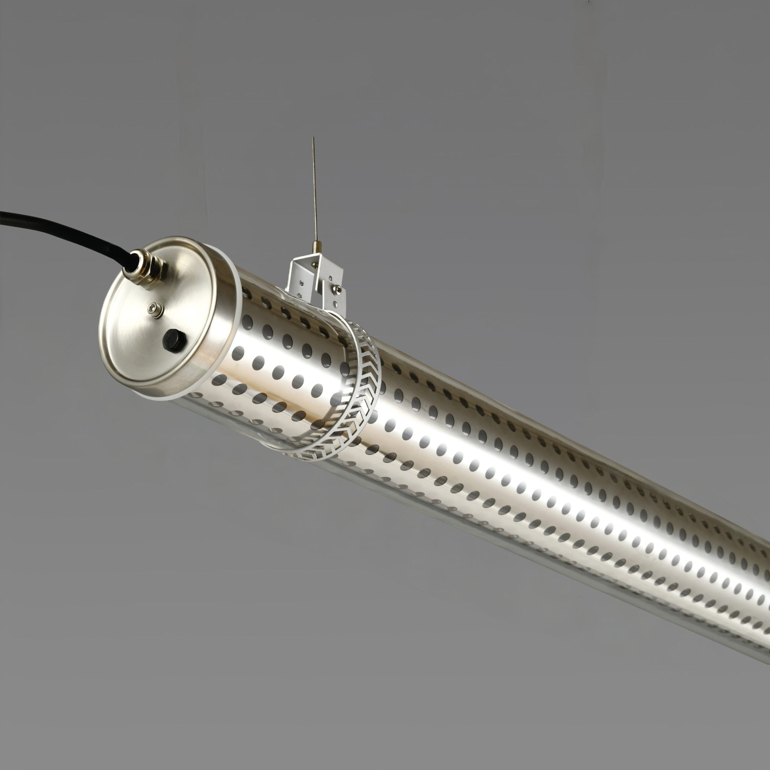 Perfo 360 architectural tubular luminaire with perforated stainless steel insert and 360° emission