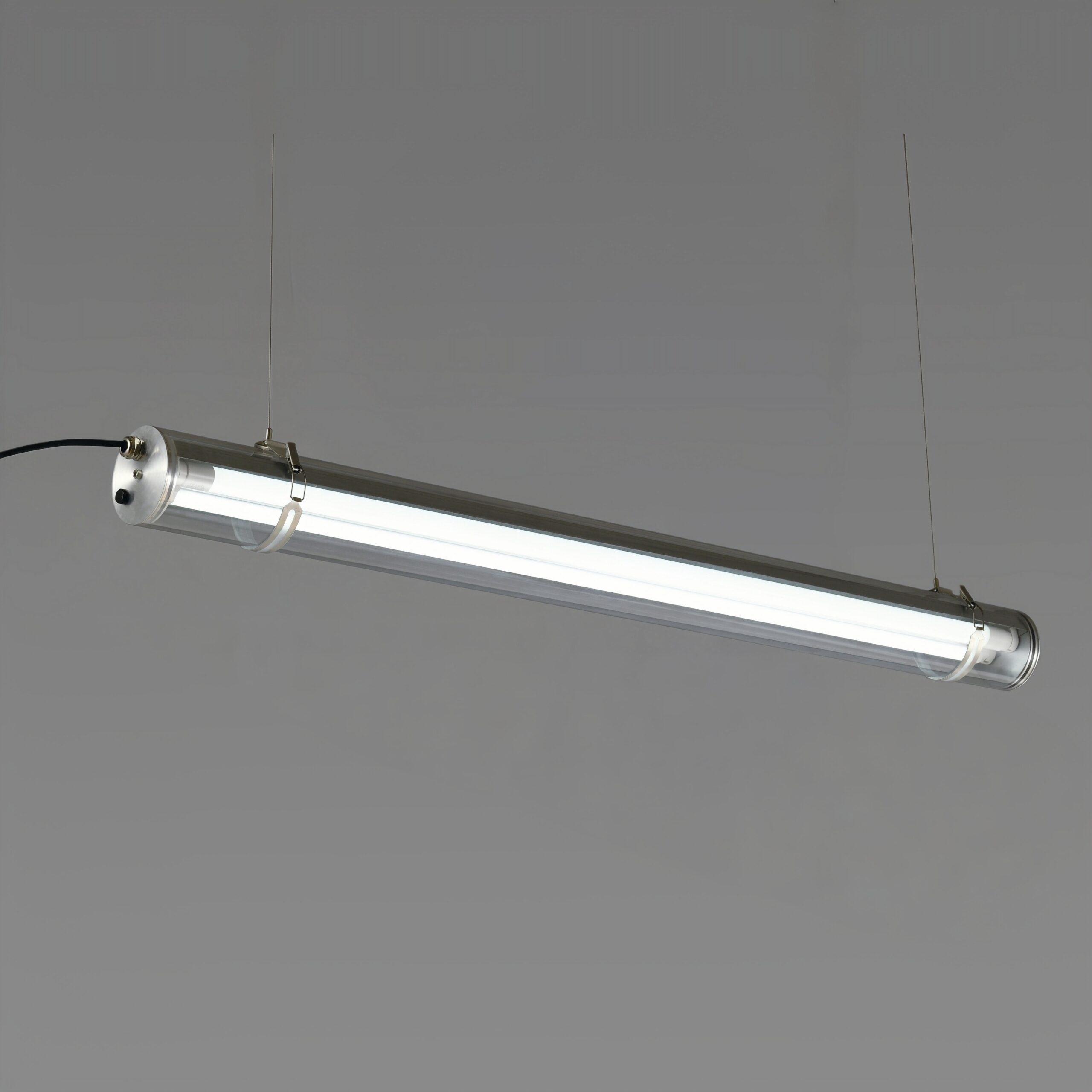 MANI Commercial tubular luminaire featuring an internal replaceable T8 LED tube, suitable for suspension or surface mounting