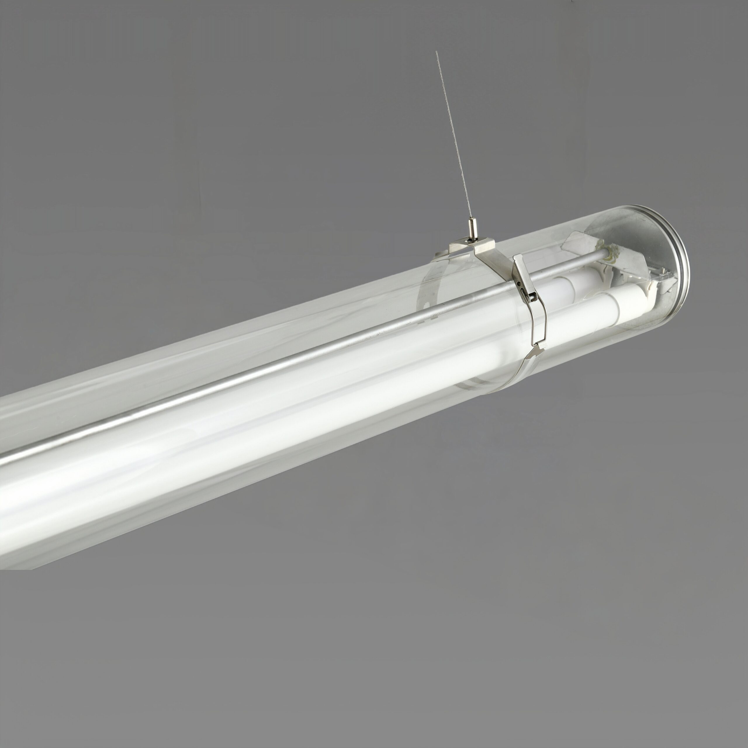 MANI Commercial tubular luminaire featuring an internal replaceable T8 LED tube, suitable for suspension or surface mounting
