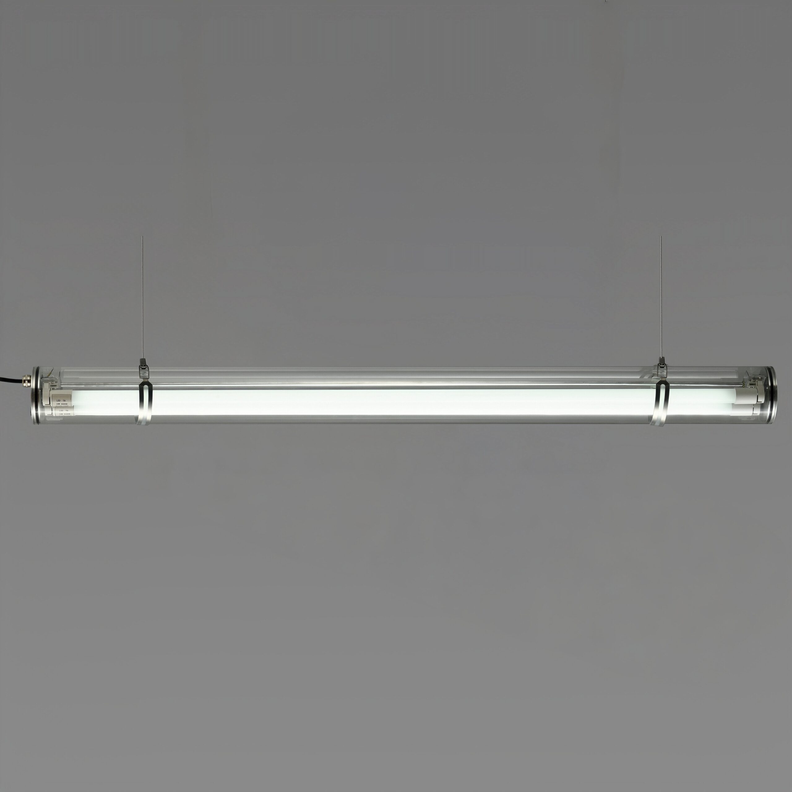 MANI Commercial tubular luminaire featuring an internal replaceable T8 LED tube, suitable for suspension or surface mounting