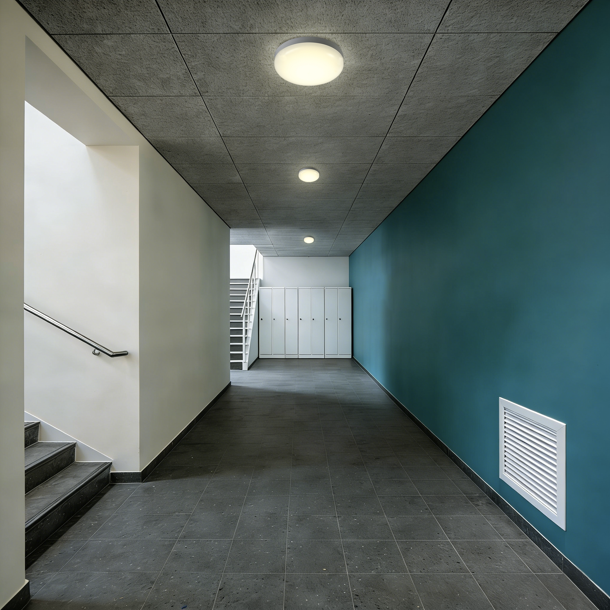 LED ceiling lights installed in building corridor providing consistent indoor circulation lighting