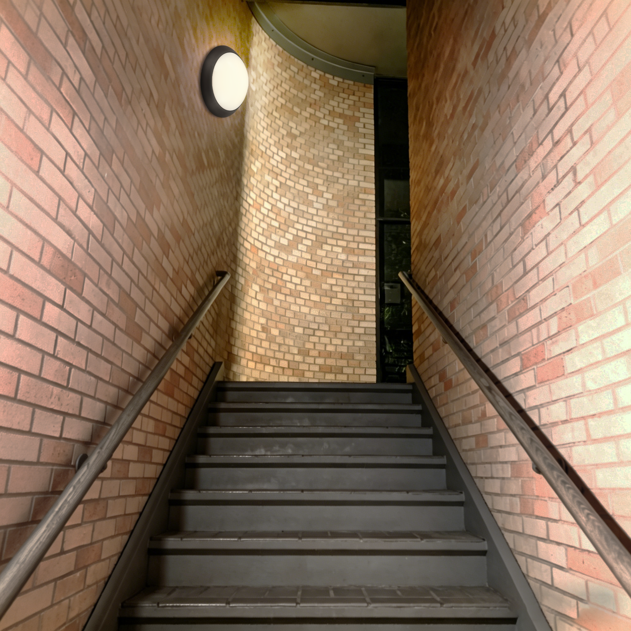 LED wall-mounted ceiling light installed in exterior building stairwell providing safe and reliable entrance lighting