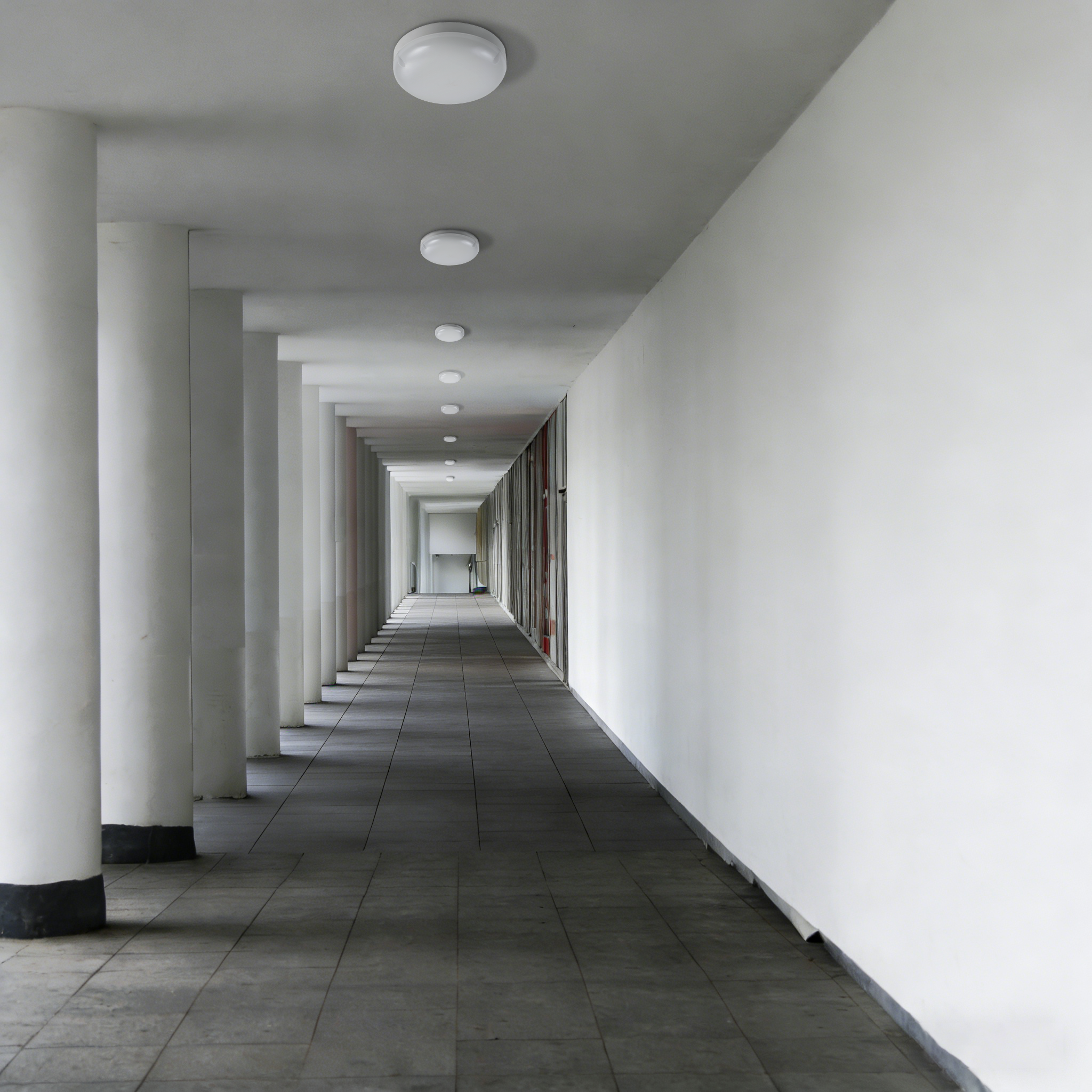 IP65 LED ceiling light used in exterior corridor ensuring reliable lighting in semi-outdoor environments