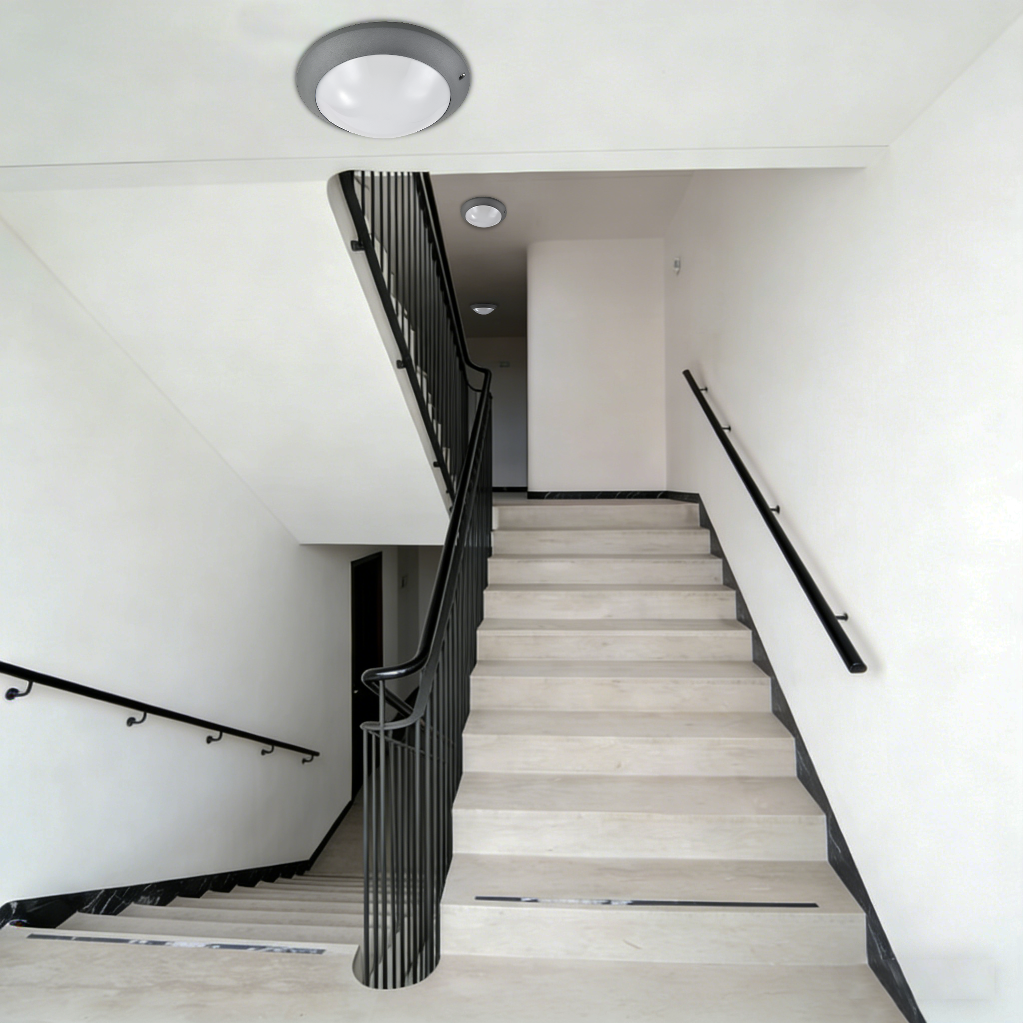 LED ceiling light installed in residential building stairwell providing safe indoor circulation lighting