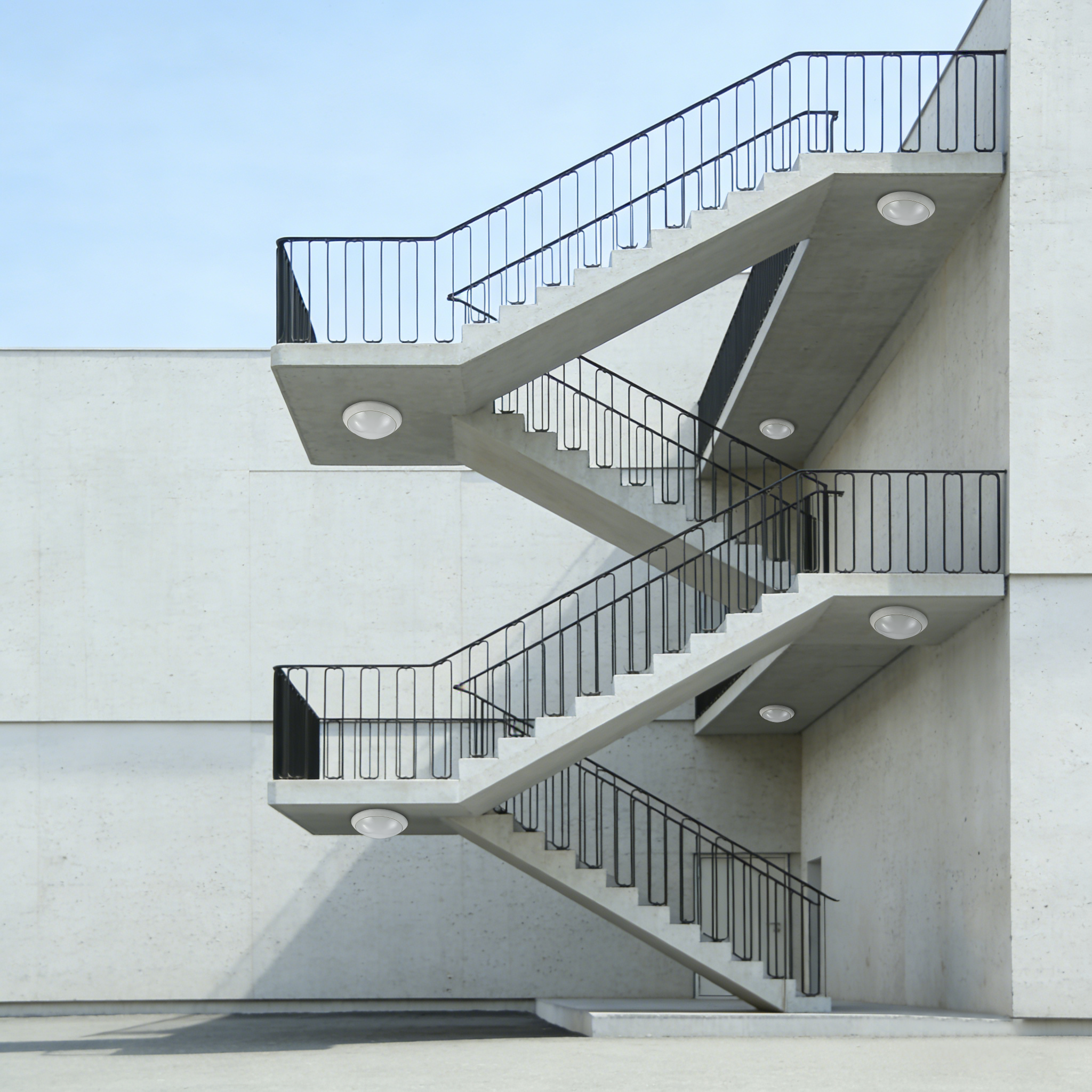 LED ceiling lights installed under exterior emergency stair providing reliable outdoor safety lighting
