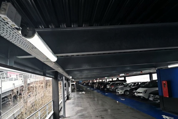 Motion sensor garage light installed in an underground parking garage