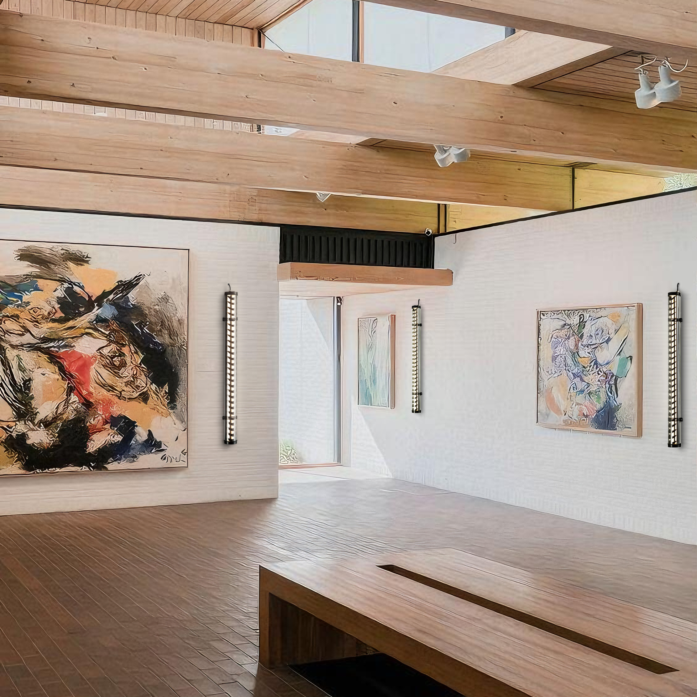 Art showroom display area with wall-mounted tubular LED lights highlighting artwork and interior surfaces