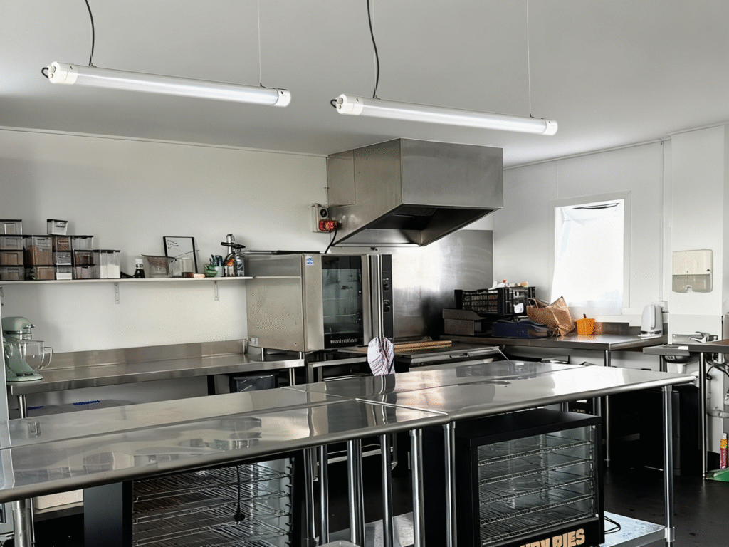 Open kitchen restaurant lighting with IP rated tubular LED fixtures